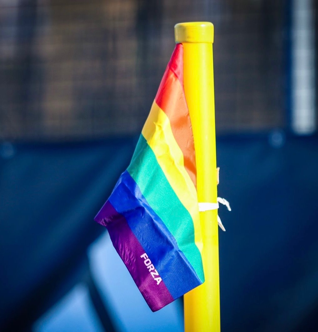 Rainbow Pride flag on a corner flag at Nottingham Hockey Centre